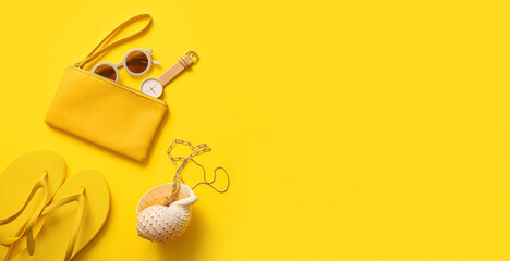 Stylish bag with seashell and different accessories on yellow background with space for text