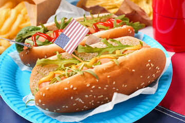 Plate with tasty hot dogs on table, closeup. Memorial Day celebration