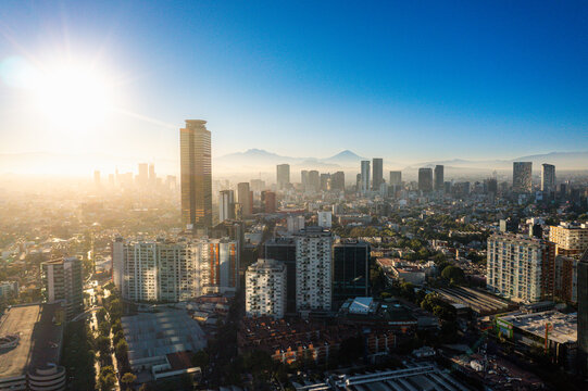 High Altitude Aerial Shot of Popocat&eacute;petl and Iztacc&iacute;huatl Volcanoes from Polanco, Mexico City at Dawn