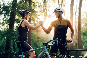 Couple getting ready for a race on their bicycles