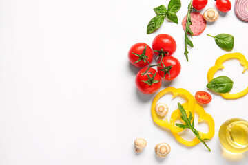 Ingredients for preparing pizza on white background