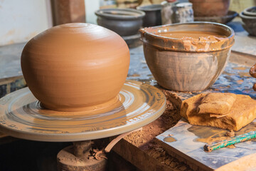 ceramics, workshop, ceramic art concept - close-up of man's hands forming a new vessel, man's...