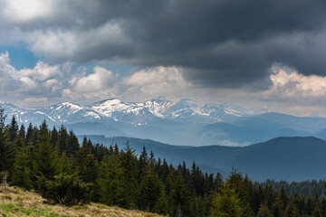 A trip through the spring mountains with a view of snow-capped peaks
