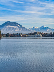 Lakeside town and snow peak mountains during a winter afternoon, Bled, Slovenia