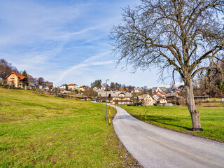 Winding road leading to a beautiful Slovenian village on Lake Bled during a winter afternoon, Bled, Slovenia