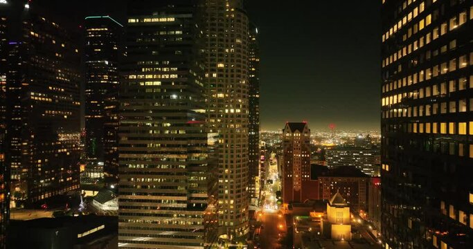 Illuminated streets downtown Los Angeles skyline at twilight dusk night. Aerial view. Los Angeles at Dusk. Aerial view of Los Angeles downtown city night skyline. LA valley California cityscape night