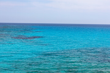 Fototapeta na wymiar Calm turquoise sea water . Blue seascape background
