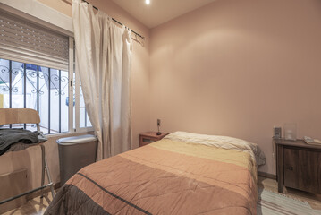 A bedroom with a double bed