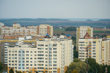 Dense urban development. A modern area of the city with beautiful multi-colored multi-storey buildings. Top view of the sleeping area of the city.