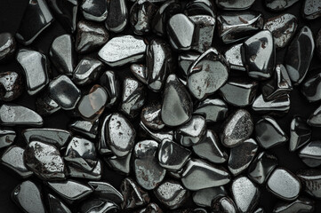 hematite chips. macro detail texture background. close-up polished semi-precious gemstone. - obrazy, fototapety, plakaty