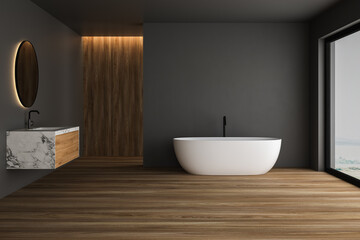 Fototapeta na wymiar Dark bathroom with wooden floor, white bathtub and white marble basin with mirror. Minimalist wooden bathroom with modern furniture and window, 3D rendering no people
