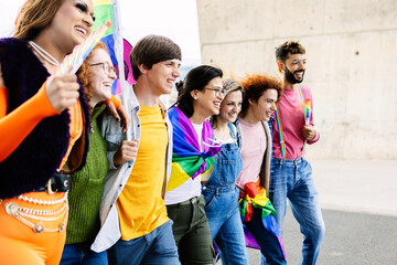 Diverse group of homosexual people having fun celebrating gay pride festival together. LGBTQIA community concept