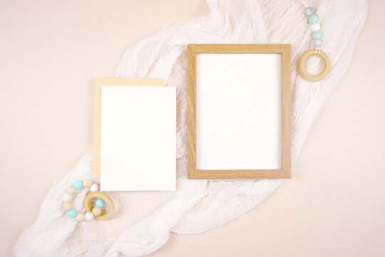 Picture frame and 5x7 card product mockup. Baby shower 1st birthday Christening gender neutral party. Styled setting against a boho Scandi theme beige and white background. Negative copy space.