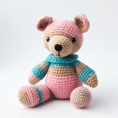 Pink and blue knitted toy teddy bear isolated on white created with Generative AI technology