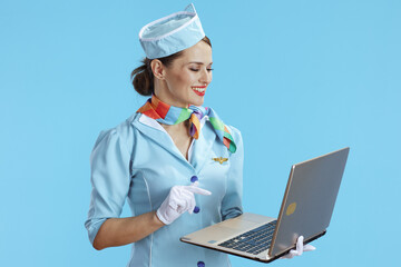 happy modern female stewardess on blue