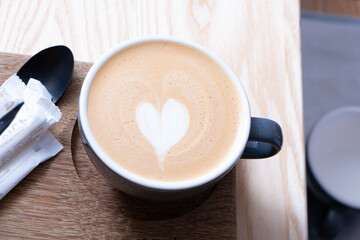 Cup of latte art in the shape of a heart