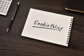 There is notebook with the word Cookie Policy.It is as an eye-catching image.