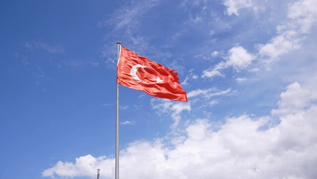 Turkish Flag Waving in Blue Sky