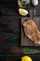 Crispy garlicky chicken raw ingredients on wooden table, top view  with copy space