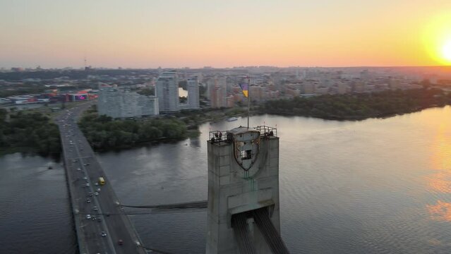 Ukraine National Flag during Sunset in Kyiv on the North Bridge