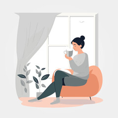 woman sitting on sofa in the morning drinking coffee