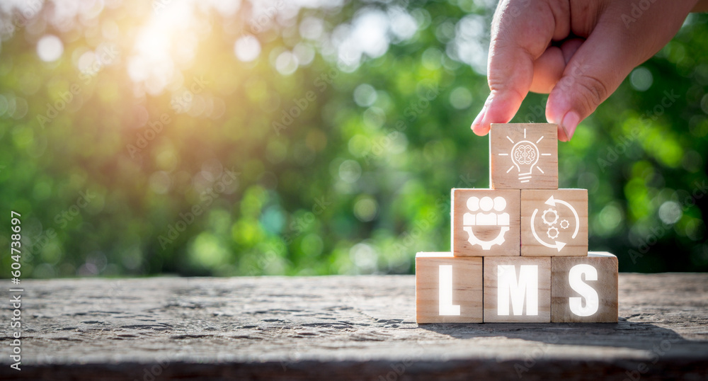 Poster lms, learning management system concept, person hand holding wooden block with learning management s