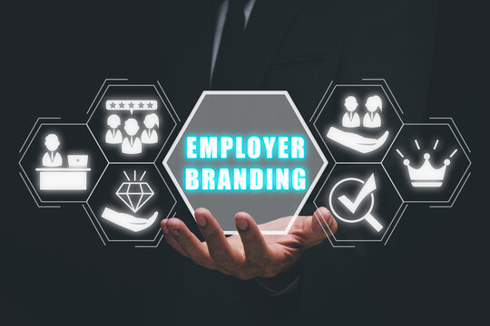 Employer branding concept, Busienssman hand holding employer branding icon on virtual screen.