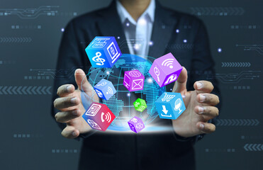 Businessman is collecting data in 3D cubic dice form about digital or online marketing. from all over the world into his hands for an advantage in doing business. Digital marketing data concept.