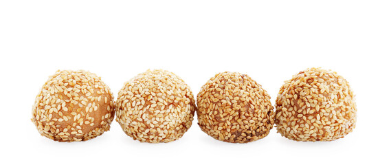 Many delicious sesame balls on white background