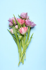 Fototapeta premium Beautiful colorful tulip flowers on light blue background, top view