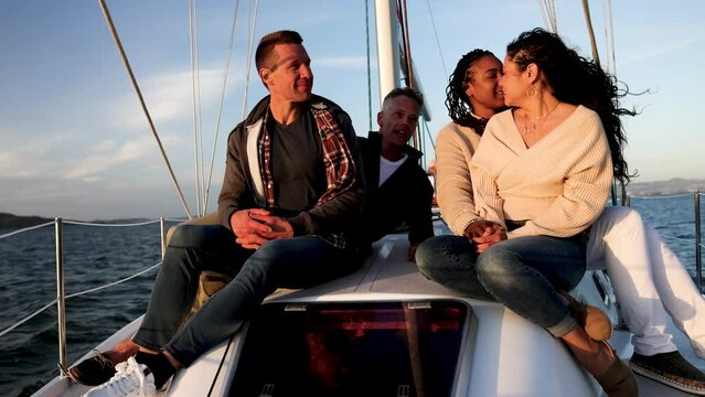 African American Latino Gay Caucasian couples on sailboat sunset San Francisco