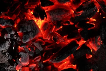Papier Peint photo Texture du bois de chauffage Pieces of hot smoldering coal as background, top view