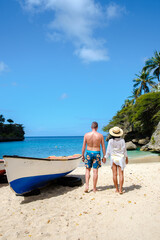 A couple of men and women at Playa Lagun Beach Cliff Curacao, Lagun Beach Curacao a small island in the Caribbean during vacation in Curacao Dutch Antilles