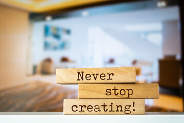 Wooden blocks with words 'Never stop creating'.