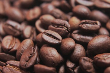 Brown Roasted Coffee Beans Closeup On Dark Background