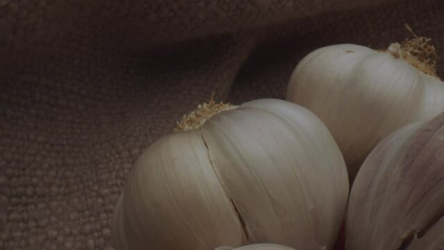 Garlic bulbs on a hessian bag Macro Slider shot 