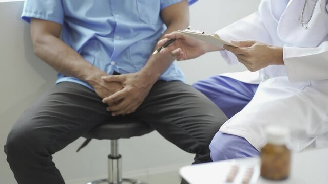 Man with prostate enlargement having examination and consulting a doctor The doctor will ask about the patient's illness and give health advice. 4k video