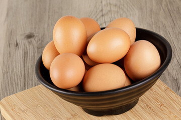 Close up of a bowl of fresh raw Brown Eggs