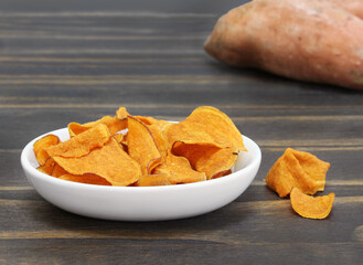 Sweet Potato Chips, macro, on a wooden table