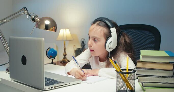 Girl Child Studying in Online Kolas at Home. Back to School, Online Learning, Distance Lesson, Homeschooling, School Technology, Tutored Lessons. Children Doing Homework at Home