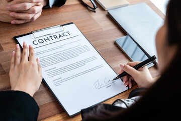 Executives sign contract in meeting room. Business people seal deal on paper. Successful agreement between two business partnership with signature signed on legal document. Jubilant - obrazy, fototapety, plakaty