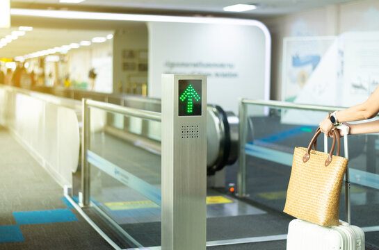 Signs entrance to escalator for passenger walking at international airport teminal