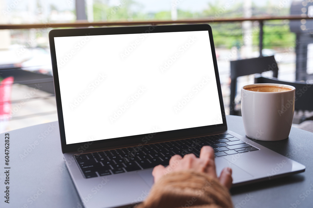 Wall mural mockup image of a woman using and working on laptop computer with blank white desktop screen