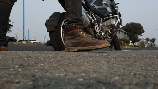 motorcyclist's foot on the pedal while driving