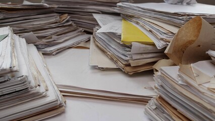 Old handwritten archival paper documents on the table