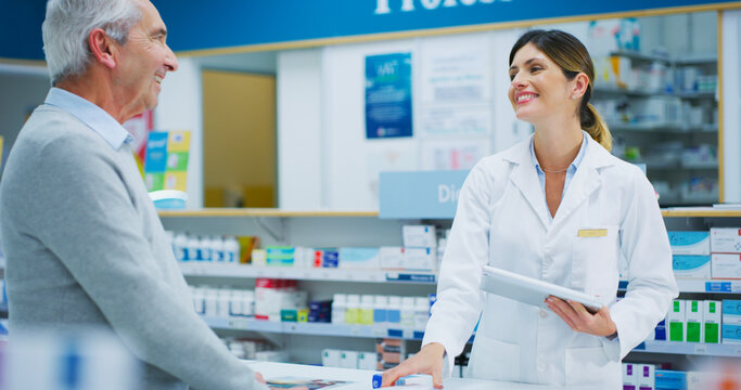 Senior patient, tablet and happy woman, pharmacist or clerk helping clinic customer, healthcare client or person. Medicine shop, pharmacy advice and chemist search online database for store product