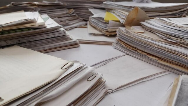 Handwritten papers on the table. Old archiv documents, handwritten book, manuscripts