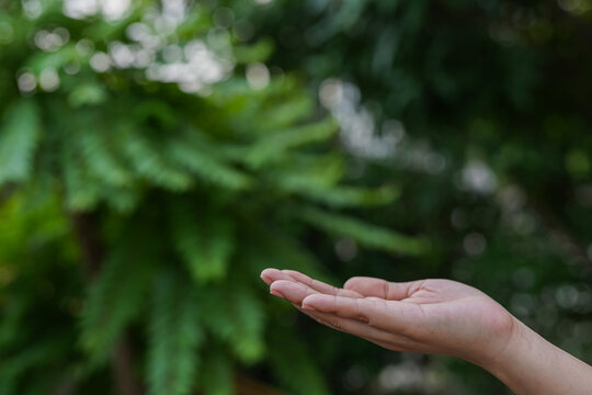 Technology, hand holding with environment Icons over the Network connection on green background.