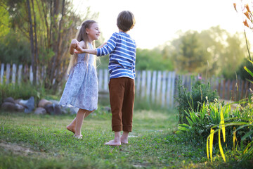 Children walk in the summer in nature. Child on a sunny spring morning in the park. Traveling with children.