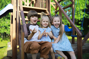 Children walk in the summer in nature. Child on a sunny spring morning in the park. Traveling with children.